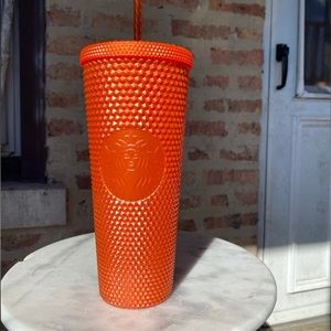 Starbucks orange studded cup